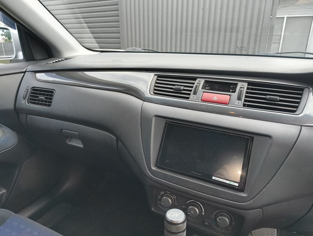 Passenger-side dash with Pioneer double-DIN head unit + factory climate controls
